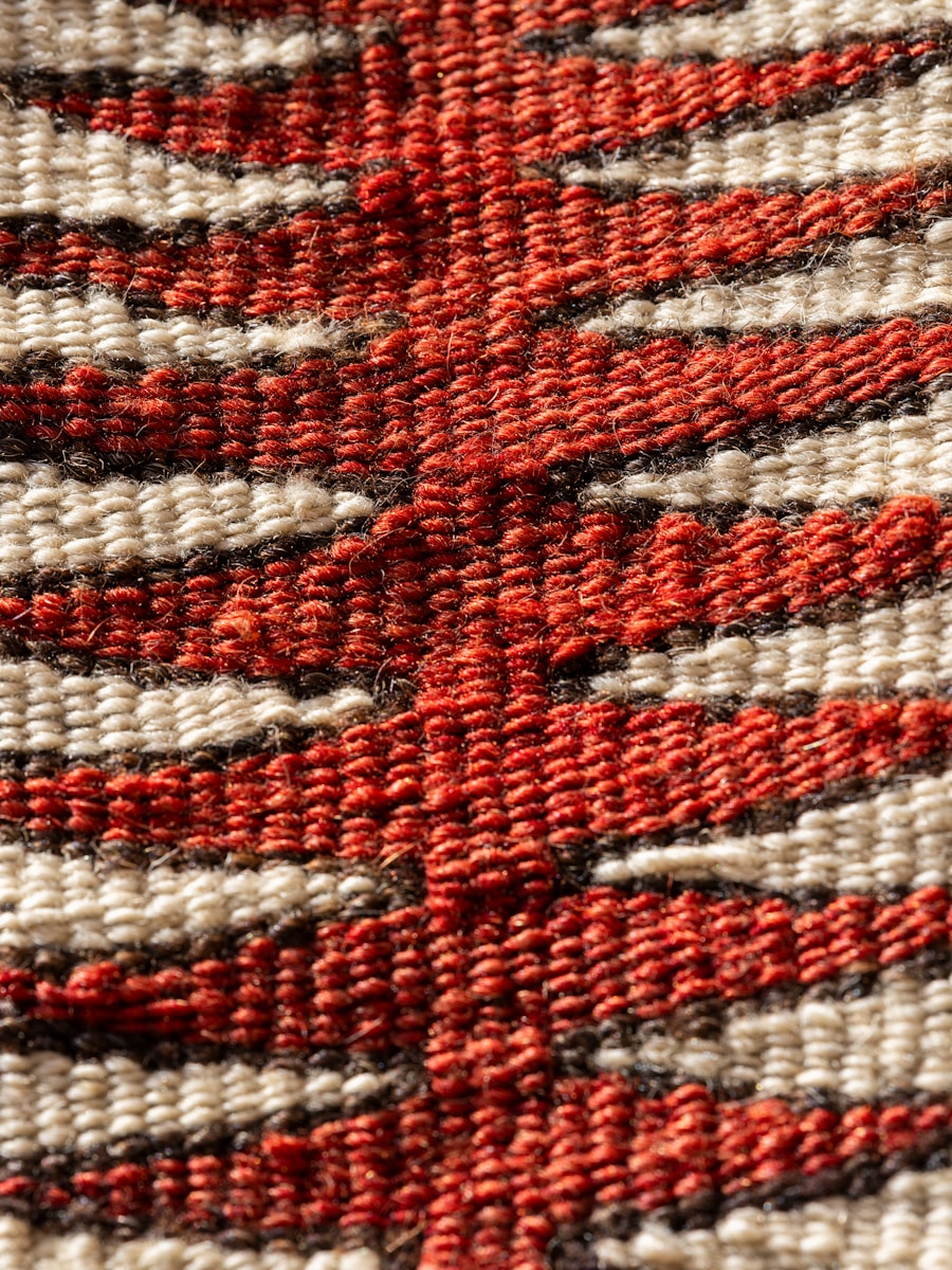 A close up of a red and white rug